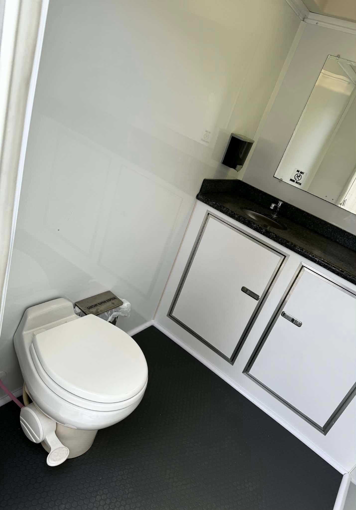 Two-stall suite vanity and private restroom interior