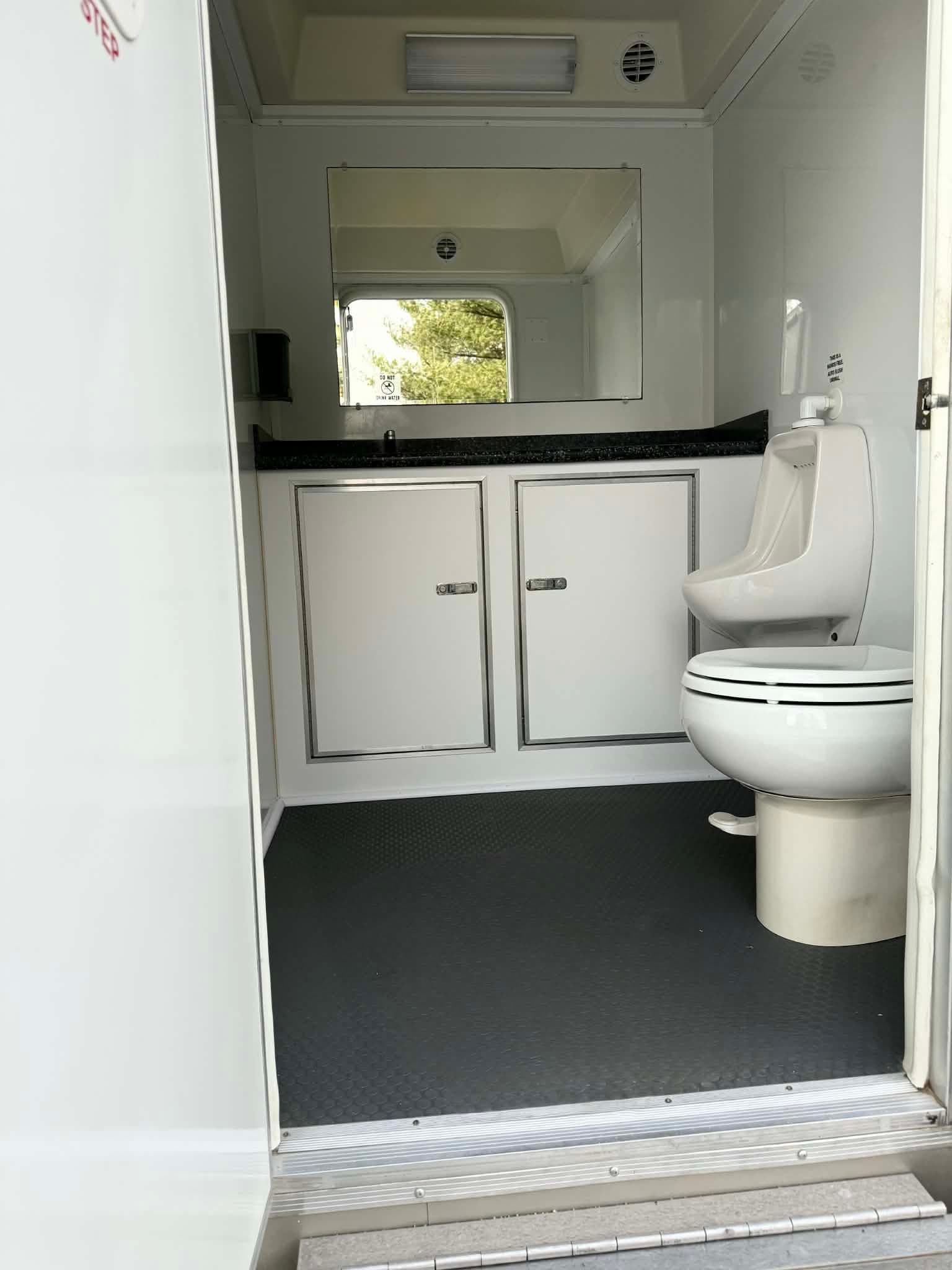Bright two-stall suite interior viewed from the doorway